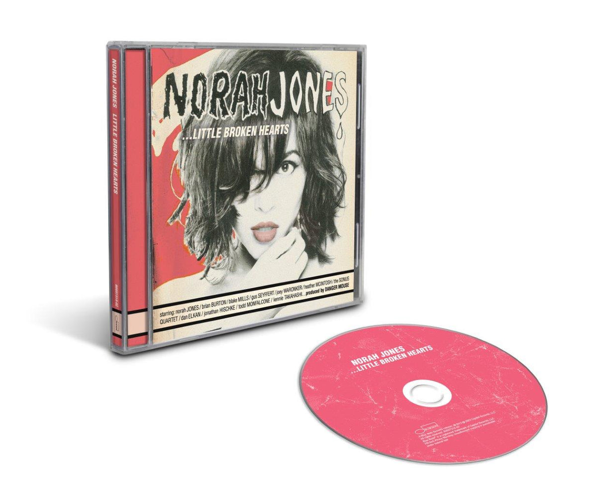Norah Jones CD case with a red disc and a woman's portrait on the cover.