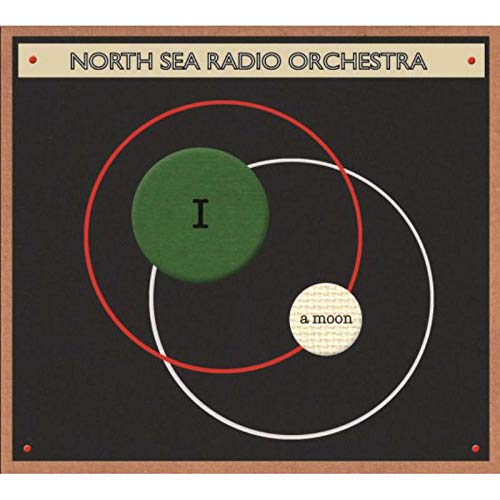 Vinyl record cover: black background with abstract circles and text.