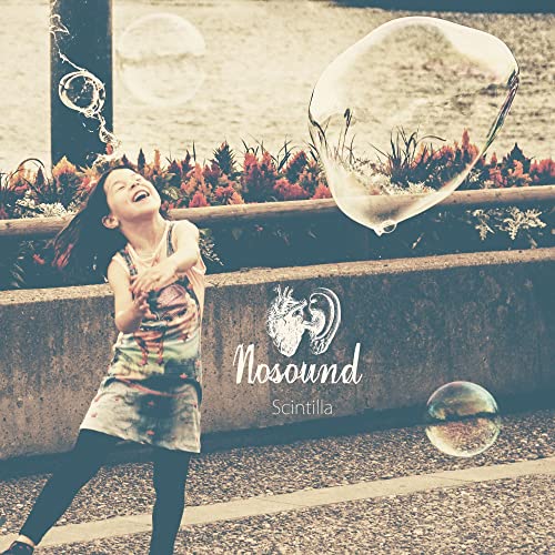 Girl laughing, blowing bubbles, album cover for Nosound’s “Scintilla” CD.