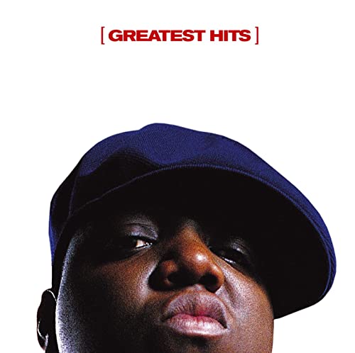 Close-up portrait of The Notorious B.I.G. wearing a dark cap against white background.