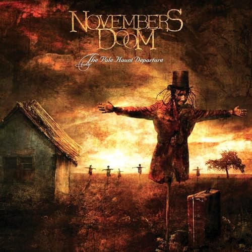 Album cover: a figure in a hat stands in a desolate, fiery landscape.