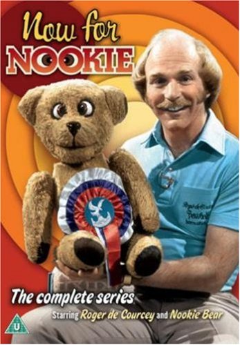 Roger De Coursey holding Nookie the Bear puppet on a DVD cover.