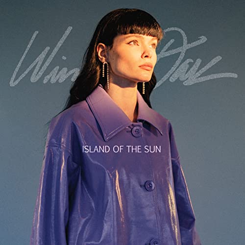 CD cover featuring Winona Oak in a purple jacket, looking left.