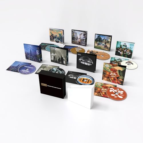 Oasis album collection: box set with multiple CD cases and discs.
