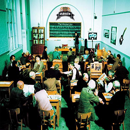 People sitting at wooden desks in a green-tinted classroom facing a chalkboard.
