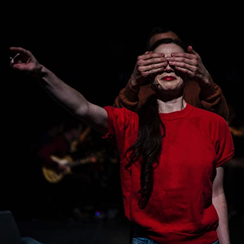 CD cover: woman in red with hands covering her eyes.