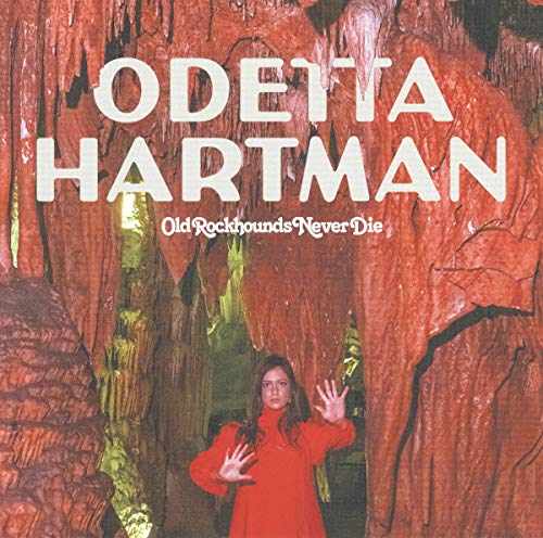 Odetta Hartman's vinyl album cover featuring a woman in red amidst red rock formations.