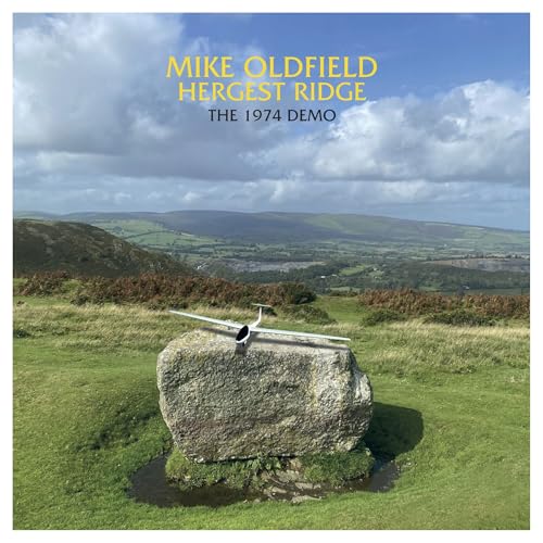 Album cover: landscape with a small airplane on a rock.