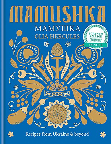 "Blue cookbook cover with gold floral design and white text, featuring award sticker."