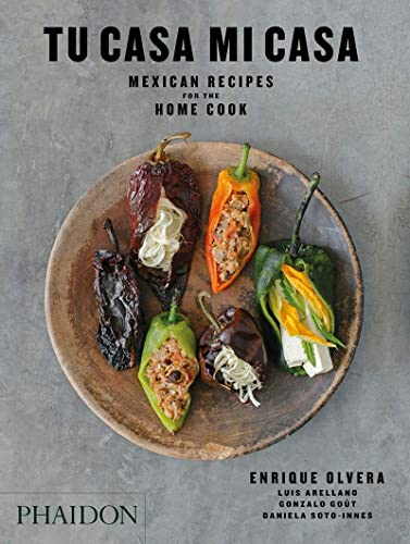 Cookbook cover: “Tu Casa Mi Casa” with stuffed chili peppers.
