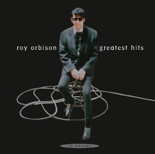 Roy Orbison album cover: black background, man in suit with microphone cable.
