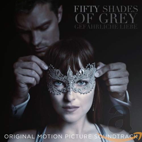 A man places a lace mask on a woman's face on the soundtrack cover.