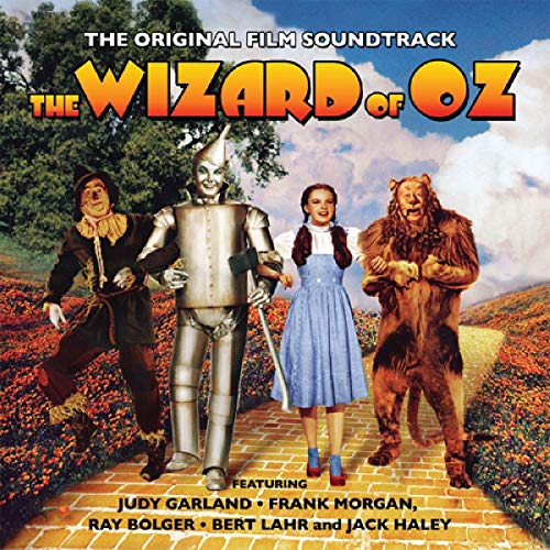 Cover of "Wizard of Oz" soundtrack CD featuring main characters on a yellow brick road.
