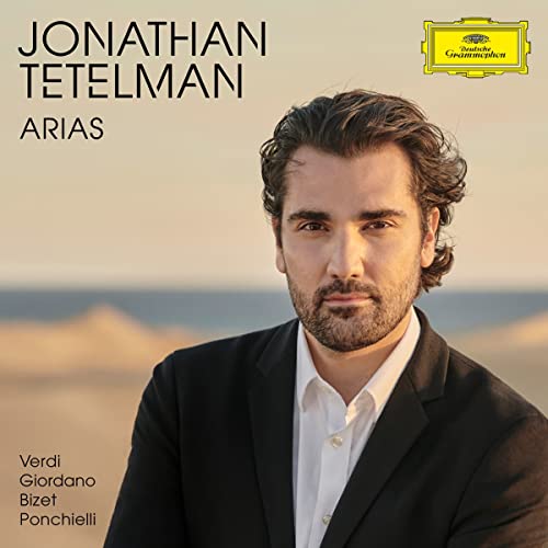 Jonathan Tetelman in a suit against a beach background for his album Arias.