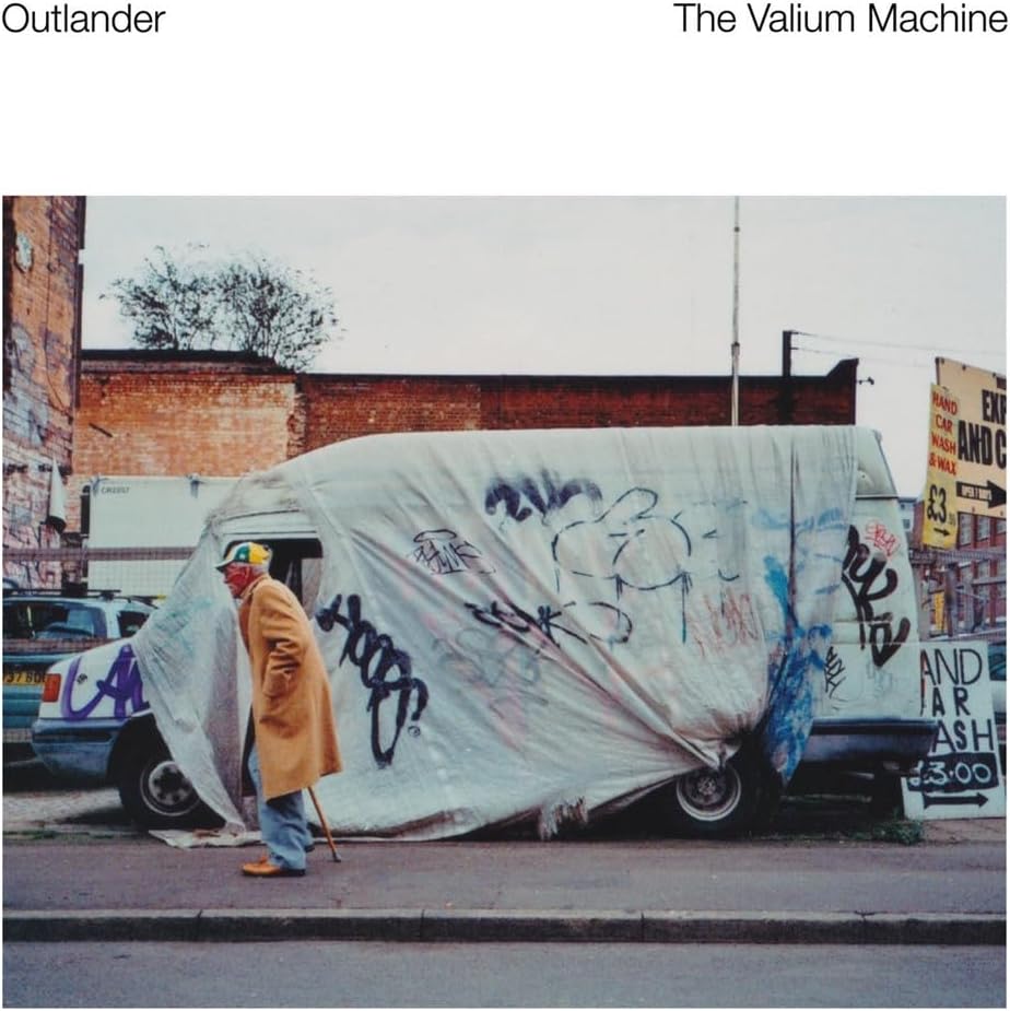 Vinyl album cover: graffiti-covered van and a person with a cane.