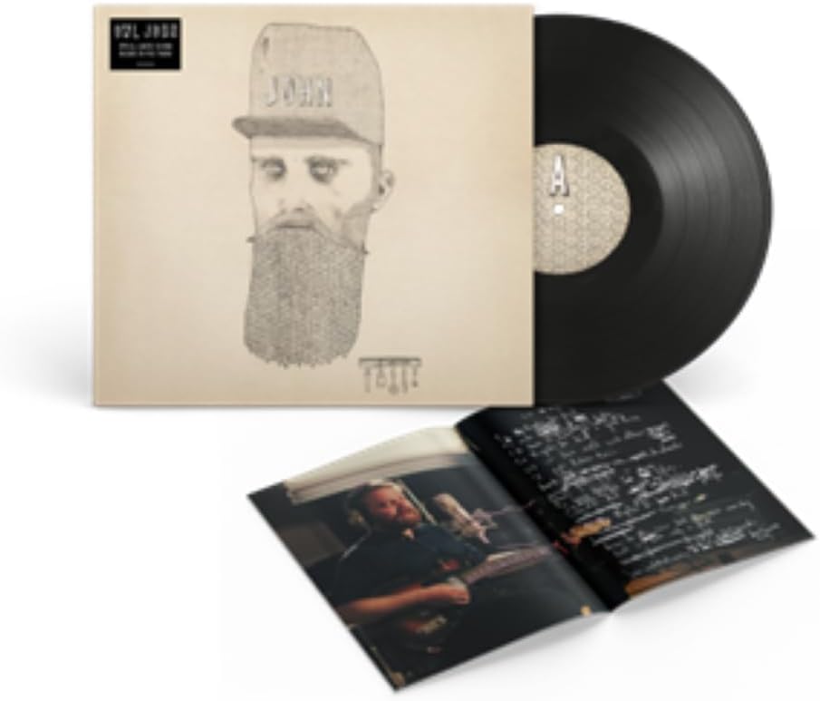 Vinyl record with sketched portrait of a bearded man in a cap.