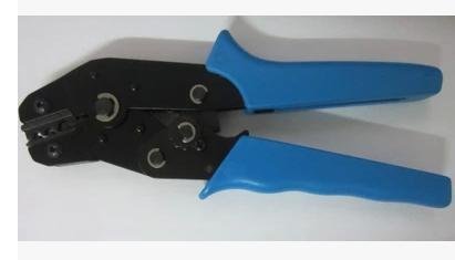 Black and blue crimping tool with multiple metal connection points.