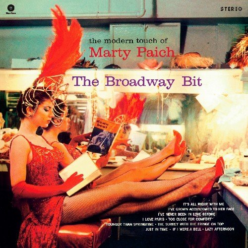 Vintage vinyl album cover featuring a woman in a red dress and feathered hat.