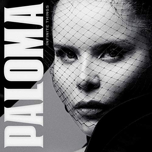 Black and white portrait of Paloma Faith with a mesh covering.
