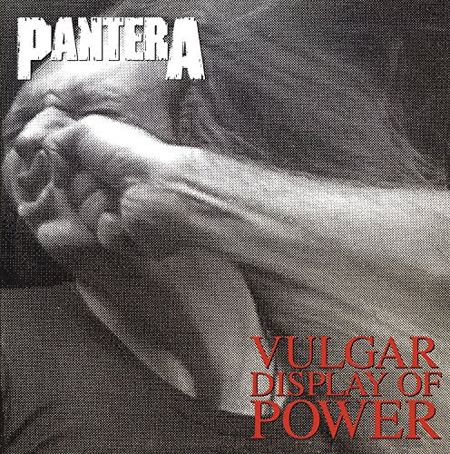 Black and white image of a fist punching a face, with Pantera album text.