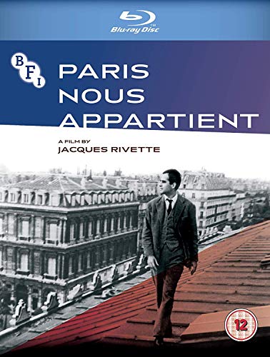 Blu-ray cover for Paris Nous Appartient featuring a man walking on a Parisian rooftop.