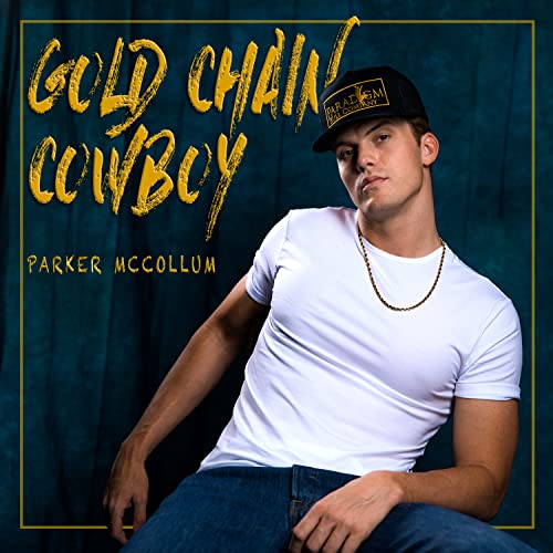 Parker McCollum wearing a white t-shirt, gold chain, and baseball cap against blue background.