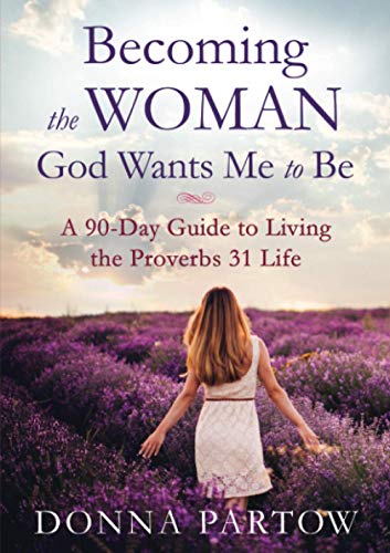 A woman in a white dress walks through a purple flower field at sunset.