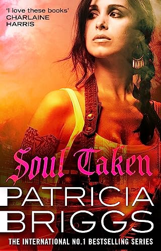 Book cover: woman with dark hair, fiery orange and black background.