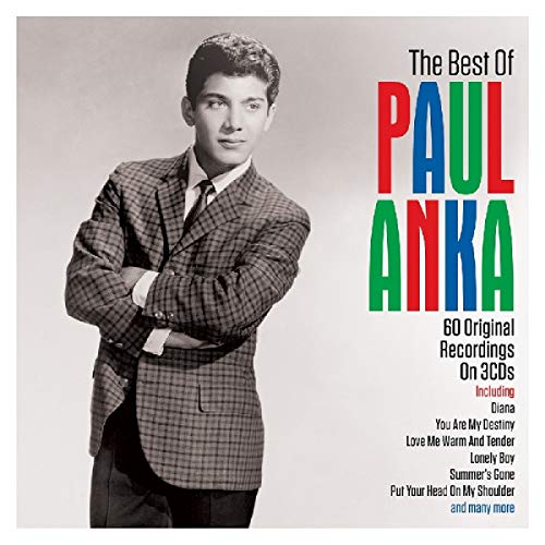 Black and white photo of Paul Anka in a plaid blazer with colorful text.