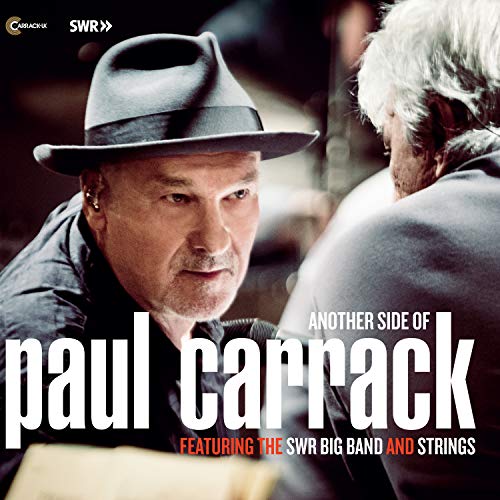 "Album cover featuring a man in a hat and text 'Paul Carrack'."