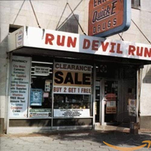 Album cover for Paul McCartney’s “Run Devil Run” featuring a vintage drugstore.