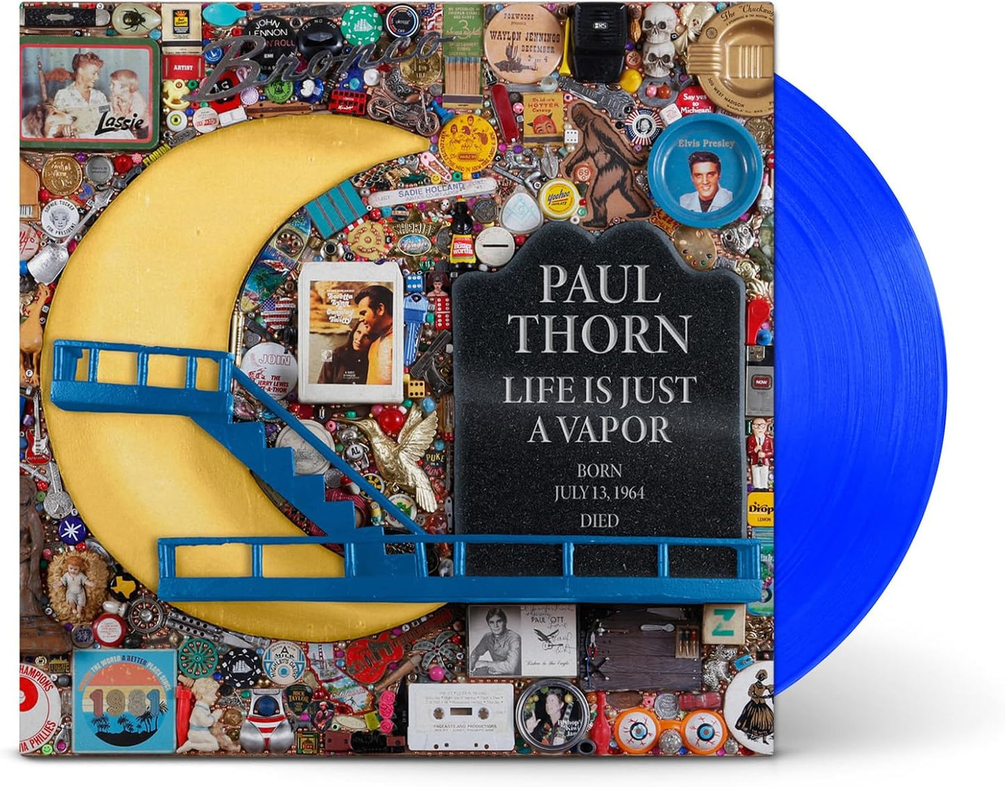 Vinyl record cover featuring a collage of trinkets, a crescent moon, and blue stairs.
