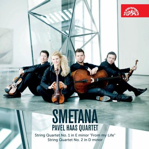 Pavel Haas Quartet posing with string instruments against a modern, geometric background.