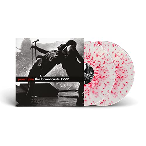 Pearl Jam album cover and two clear vinyl records with red splatter.