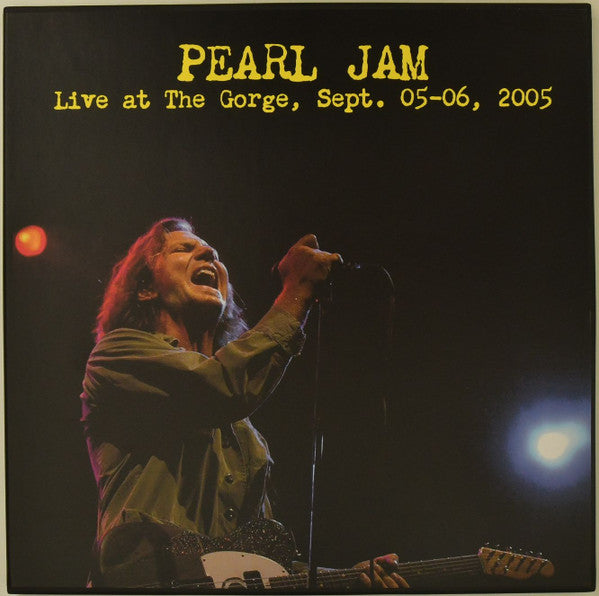 Pearl Jam live album cover featuring Eddie Vedder singing with a guitar.