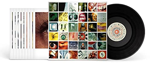 Pearl Jam’s “No Code” vinyl record with collage album art and label.