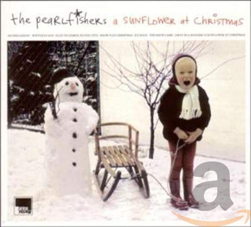 CD cover: child with snowman in snowy winter landscape.