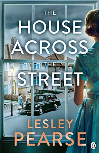 Book cover: woman looking at a street scene through a window.