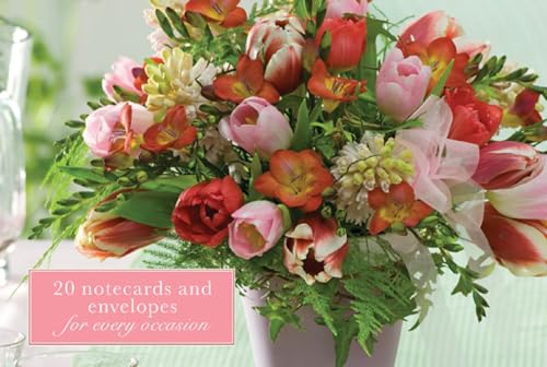 Bouquet of freesias, tulips, and other flowers with notecard packaging.