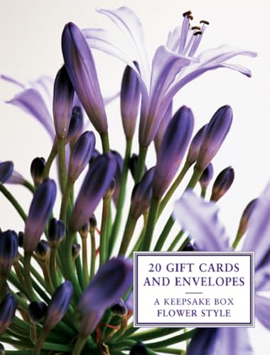 Gift cards and envelopes in a tin box with purple flower design.