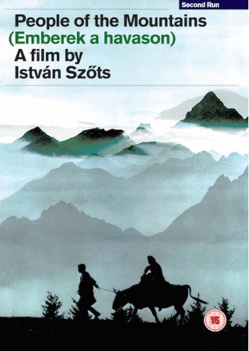 DVD cover: Silhouette of people with livestock before a mountain range.