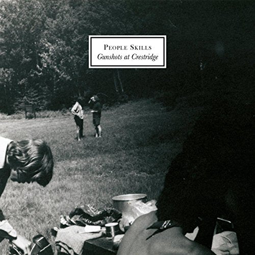 Black and white album cover showing people in a grassy field.