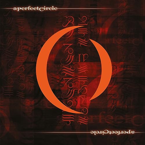 A Perfect Circle Mer De Noms album cover with orange crescent symbol on dark background.