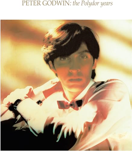 CD cover featuring Peter Godwin in a white shirt and bowtie against golden light.