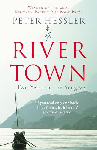 Book with a river or landscape on the cover, possibly with Asian-inspired design elements.