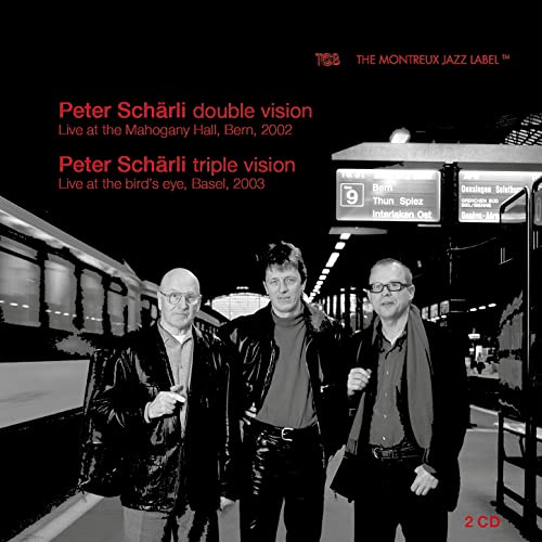 CD cover: Peter Schärli with two other men in a grayscale railway scene.