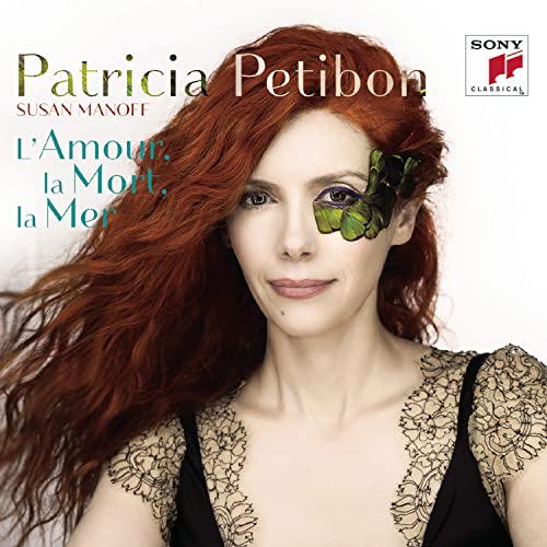 CD cover featuring red-haired woman with butterfly detail and text.