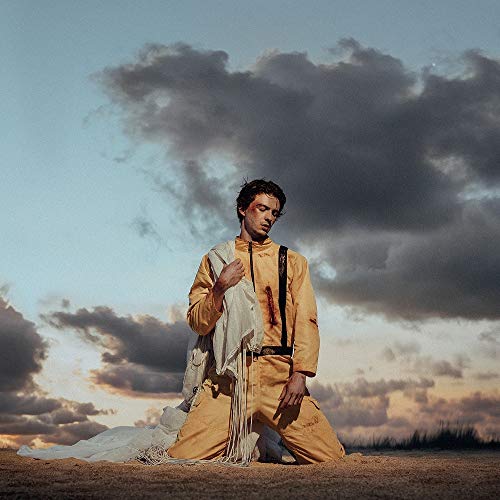 Album cover for Petit Biscuit's "Parachute" featuring a man in orange.