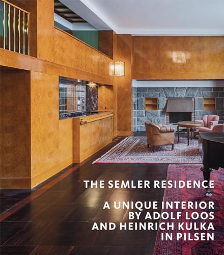 Interior view of the Semler Residence with wooden paneling and fireplace.