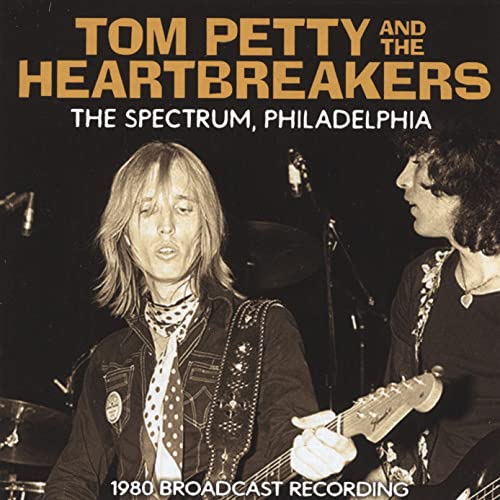 Tom Petty and The Heartbreakers album cover, live performance photo.
